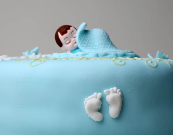 A blue boy christening baptism celebration cake by Quigleys cafe bakery and deli
