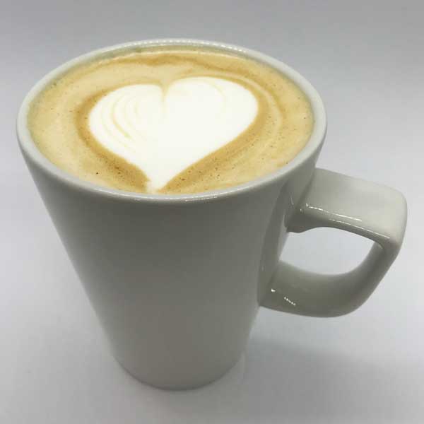 A chai latte with heart shaped coffee art from Quigleys cafe, bakery and deli
