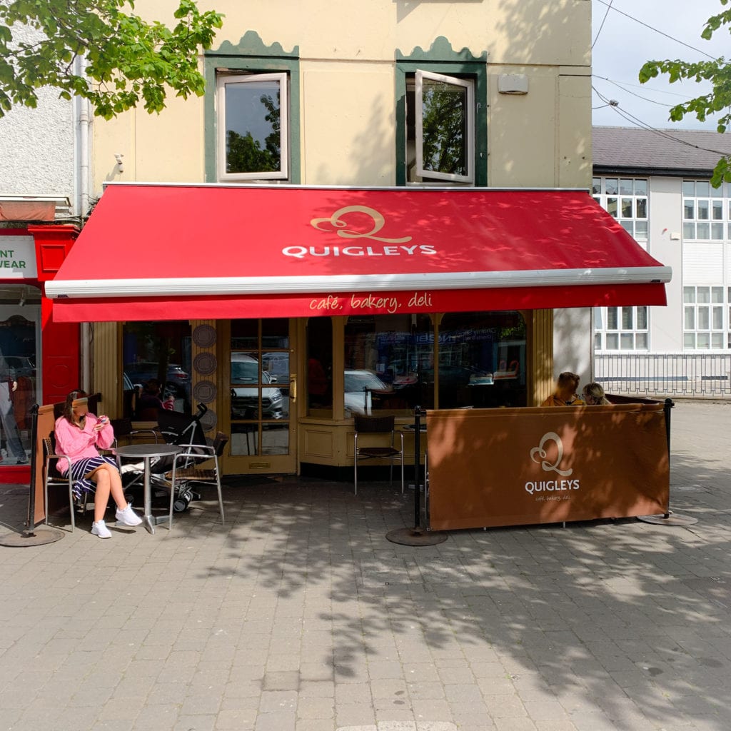 The exterior of Quigleys cafe on a sunny day